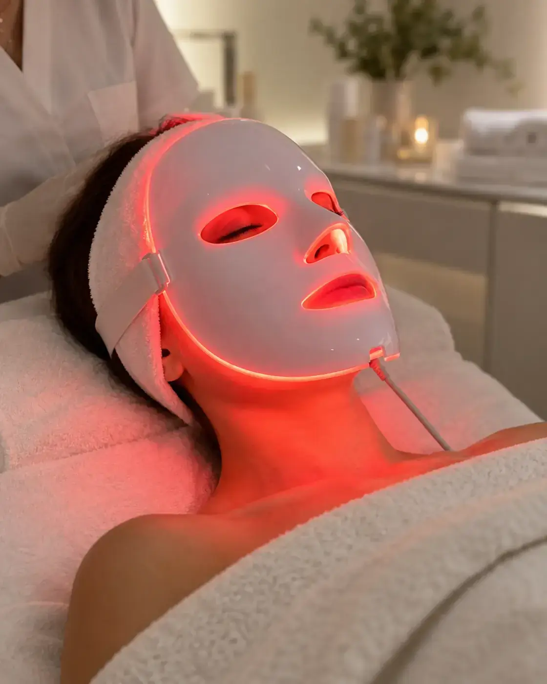 LED light therapy as a finishing step of an advanced facial at Perfecta by Marina Stejar, Scottsdale — a red-light mask over the face while the client rests
